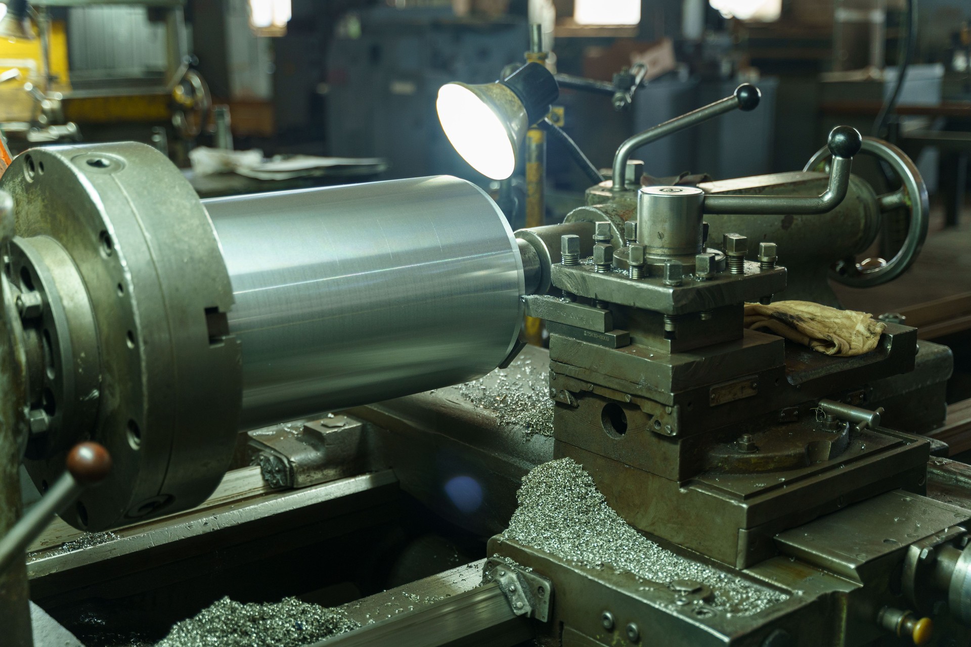 Machining precision parts in a bustling workshop during the golden hour
